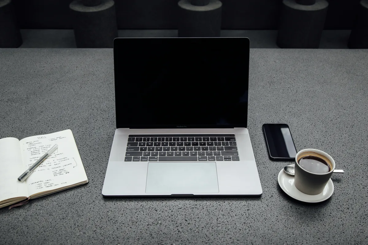 Smartphone beside laptop on office desk